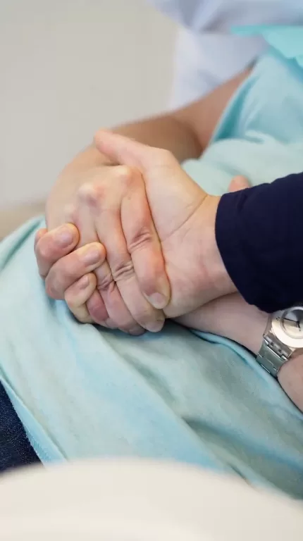 dentist holding hand