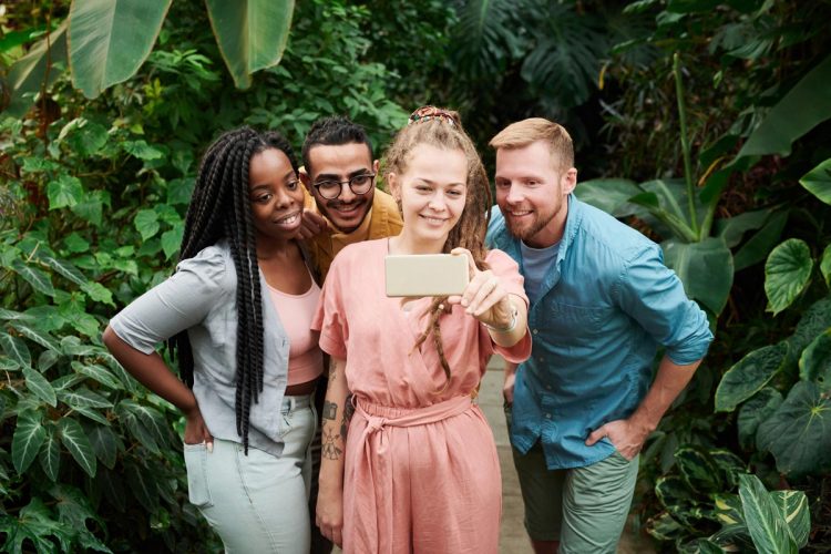 Brighter Smiles This Spring With Veneers group of people taking a selfie